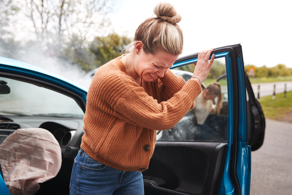 Woman shows signs of injury after a car accident