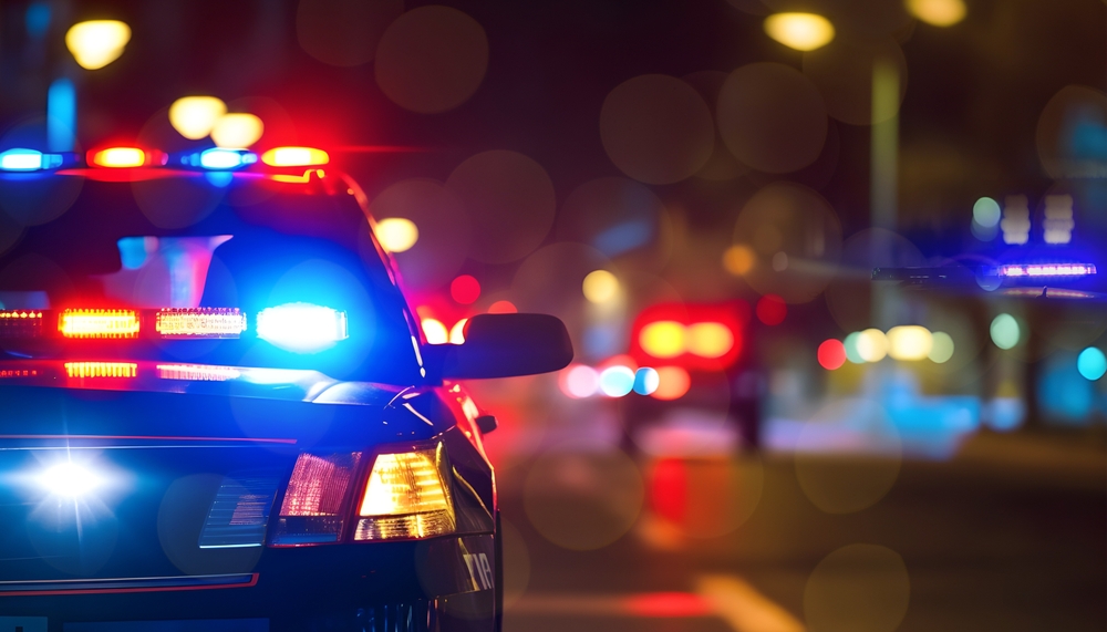 Night scene of police cars with emergency lights on